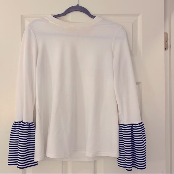 White top with black and white ruffle sleeves. - Picture 1 of 3